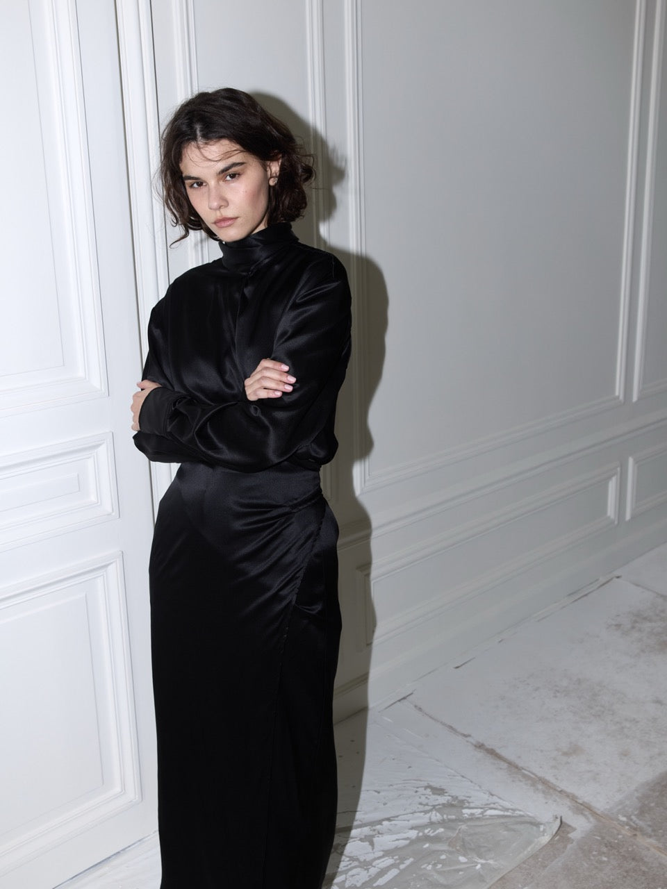 LAVA black vegan silk wrap dress, front view on model