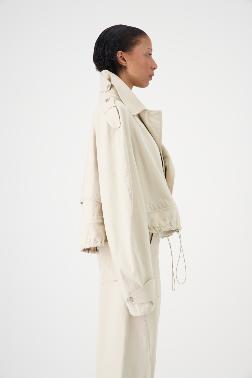 CARAVEL cotton gabardine trench coat, mid-length side view on model