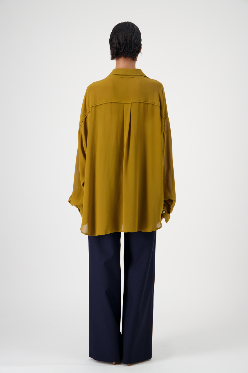 DOM silk crêpe georgette shirt, ocher color, oversized fit, back view on woman model