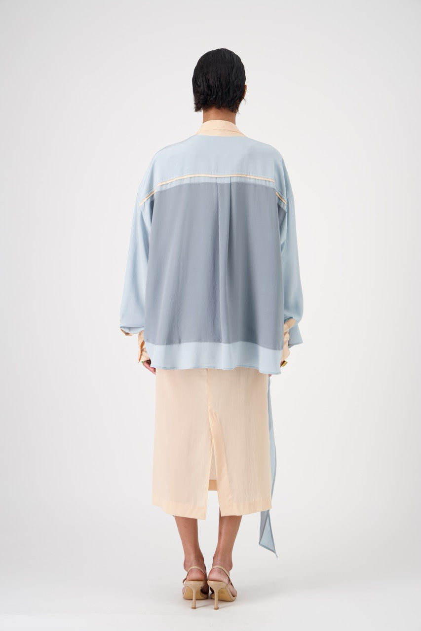 LAVA silk top with lavallière knot collar, wide side view on model