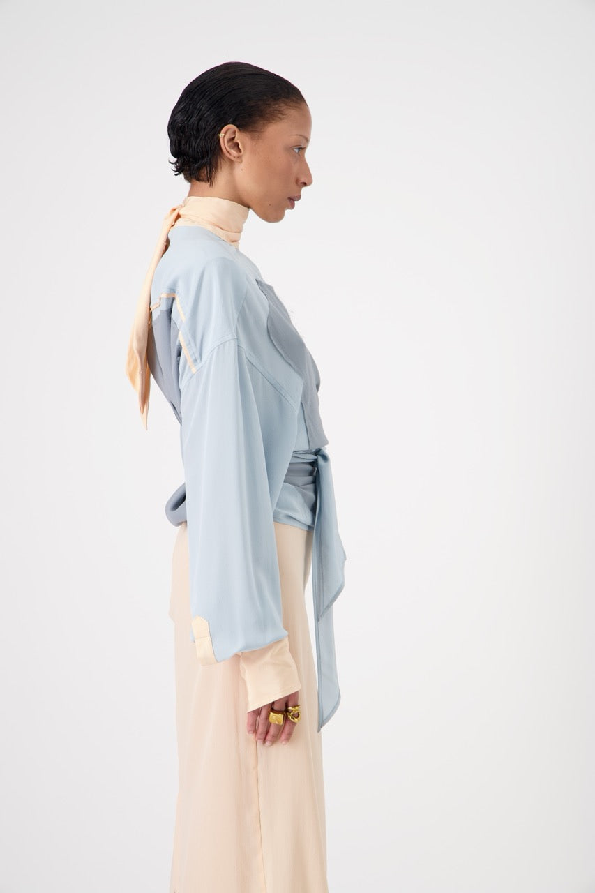 LAVA silk top with lavallière knot collar, side view with knots on model