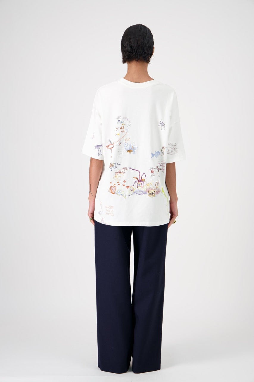 SUN oversized unisex cotton and SeaCell T-shirt, back view on woman model, dark pants
