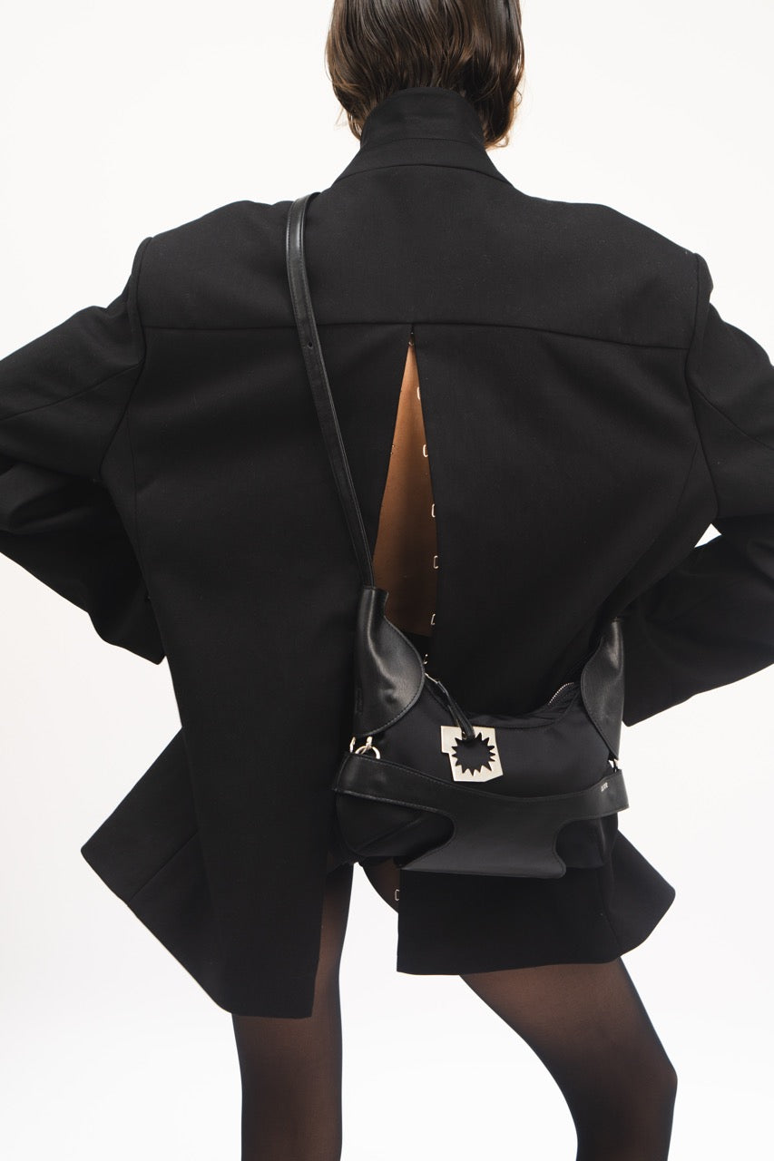 CULOTTE bag in black, with long-length handle, Alter Designs signature accessory, front view on model