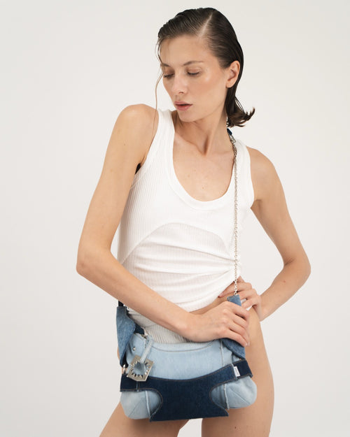 CULOTTE bag in denim, long-length handle, Alter Designs signature accessory, front view on model